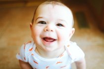 Portrait of a cute little girl in a white shirt — Stock Photo