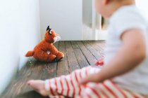 Little boy with a dog in the room — Stock Photo