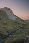 A group of young people with tents watching sunset while the moon rise, The Pyrenees, Aragon, Huesca — Stock Photo