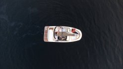 Aerial view of boat on dark water of lake in Ontario, Canada. — Stock Photo