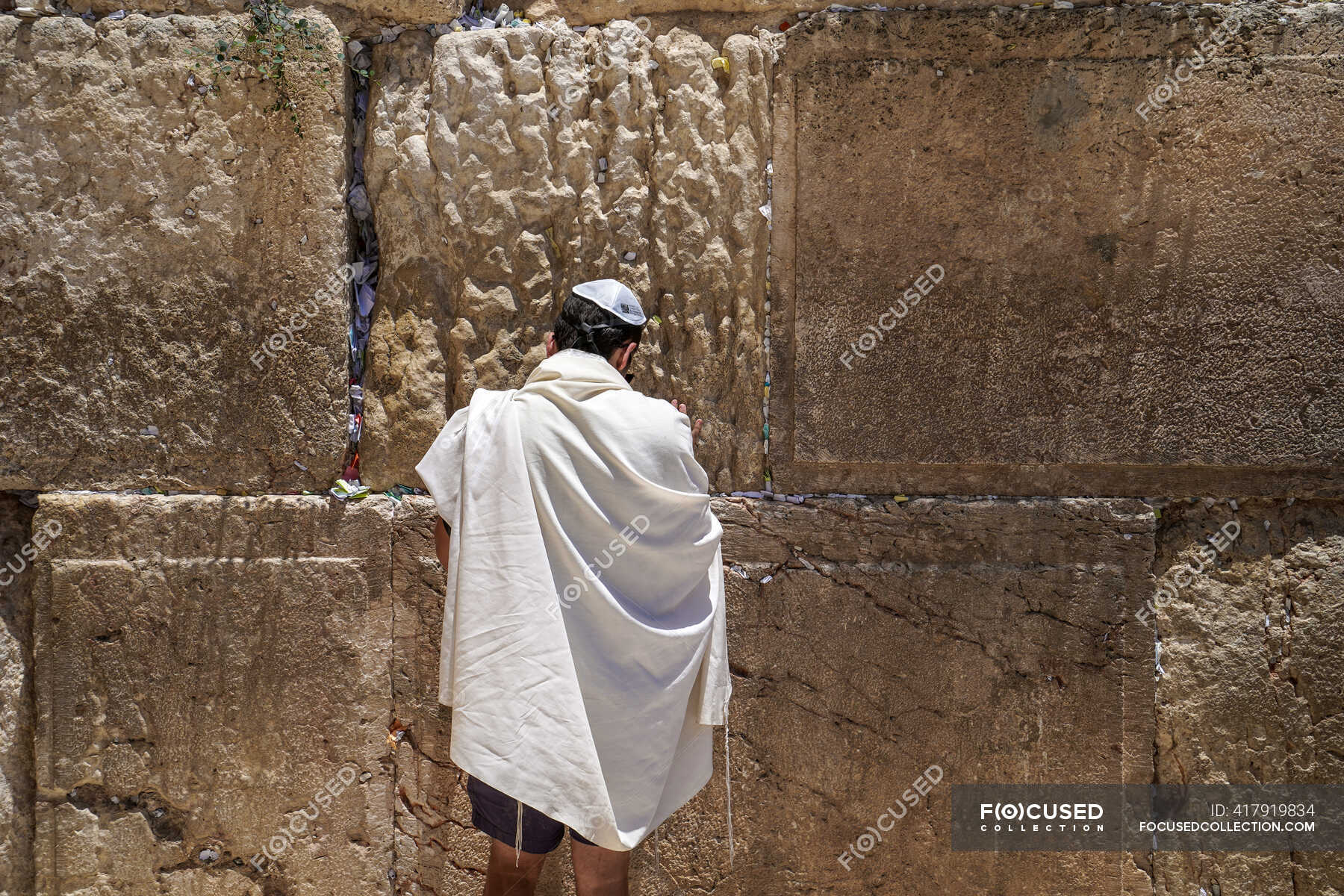 A man is praying in front of the Western Wall, Jerusalem, Israel ...