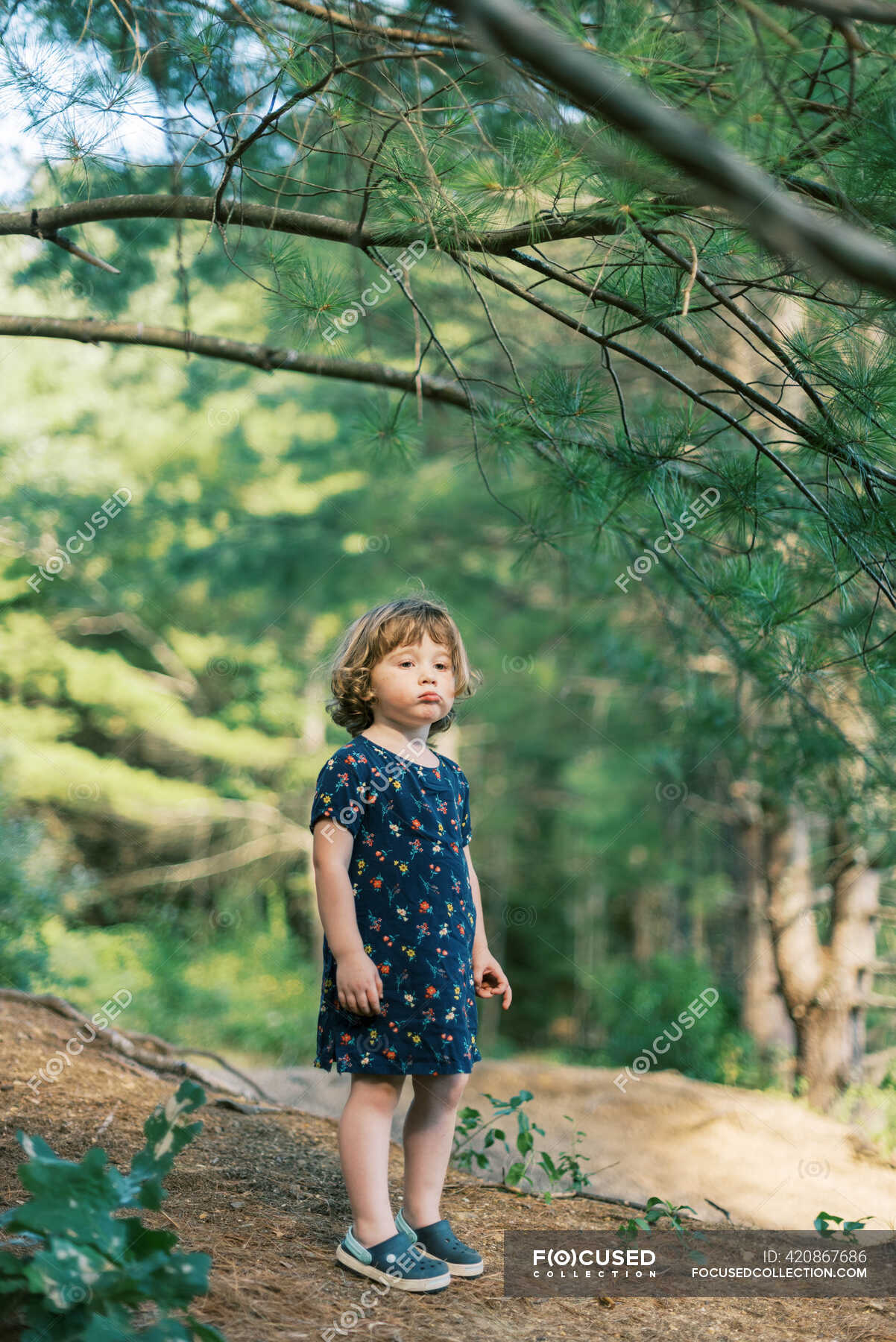 a-two-year-old-girl-looking-grumpy-during-her-nature-hike-run-east