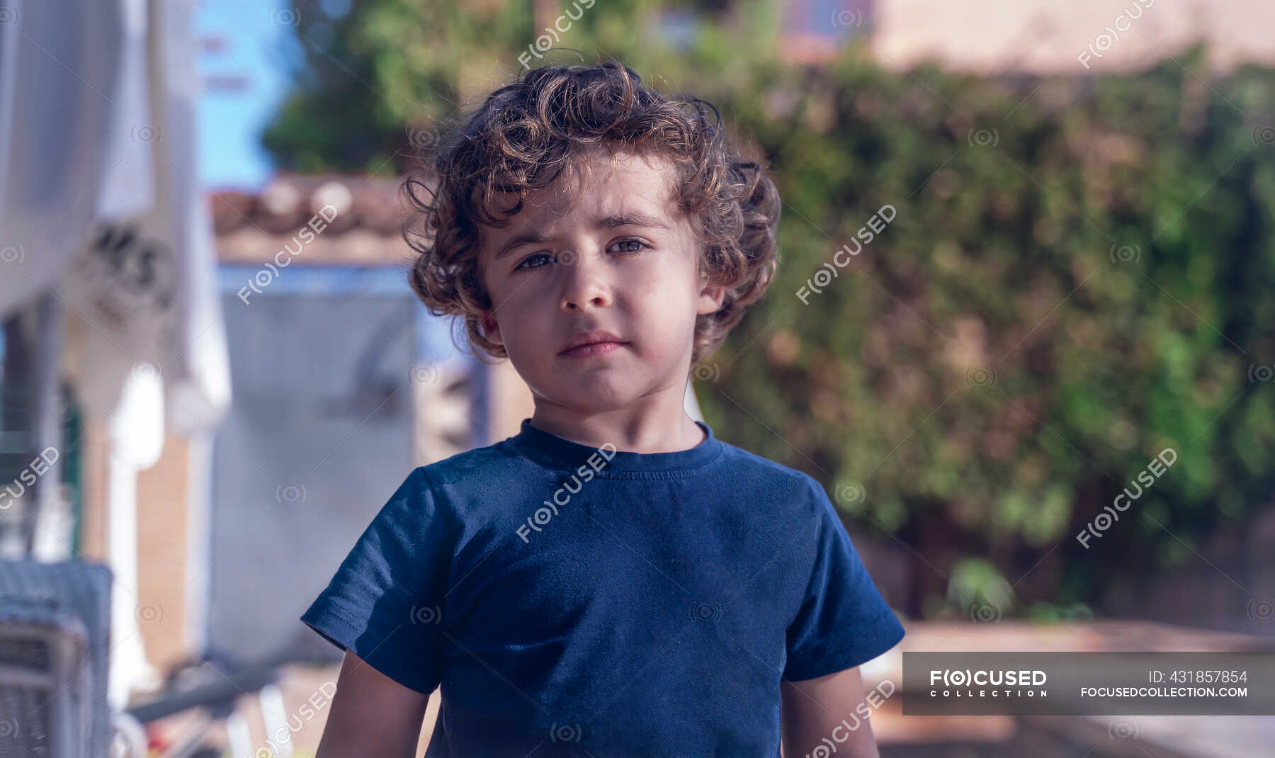 portrait-of-a-young-boy-of-7-years-old-in-the-garden-of-a-rural