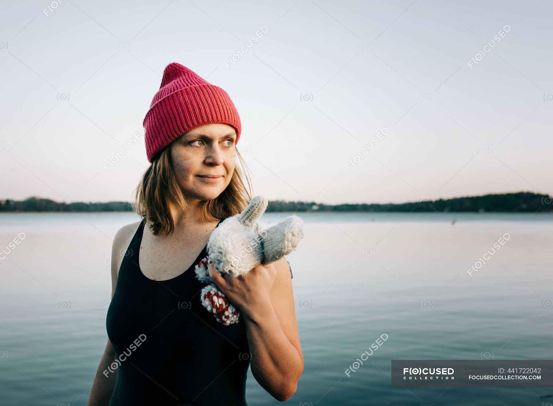 Nordic woman stood in the baltic sea breathing ready for cold swimming ...