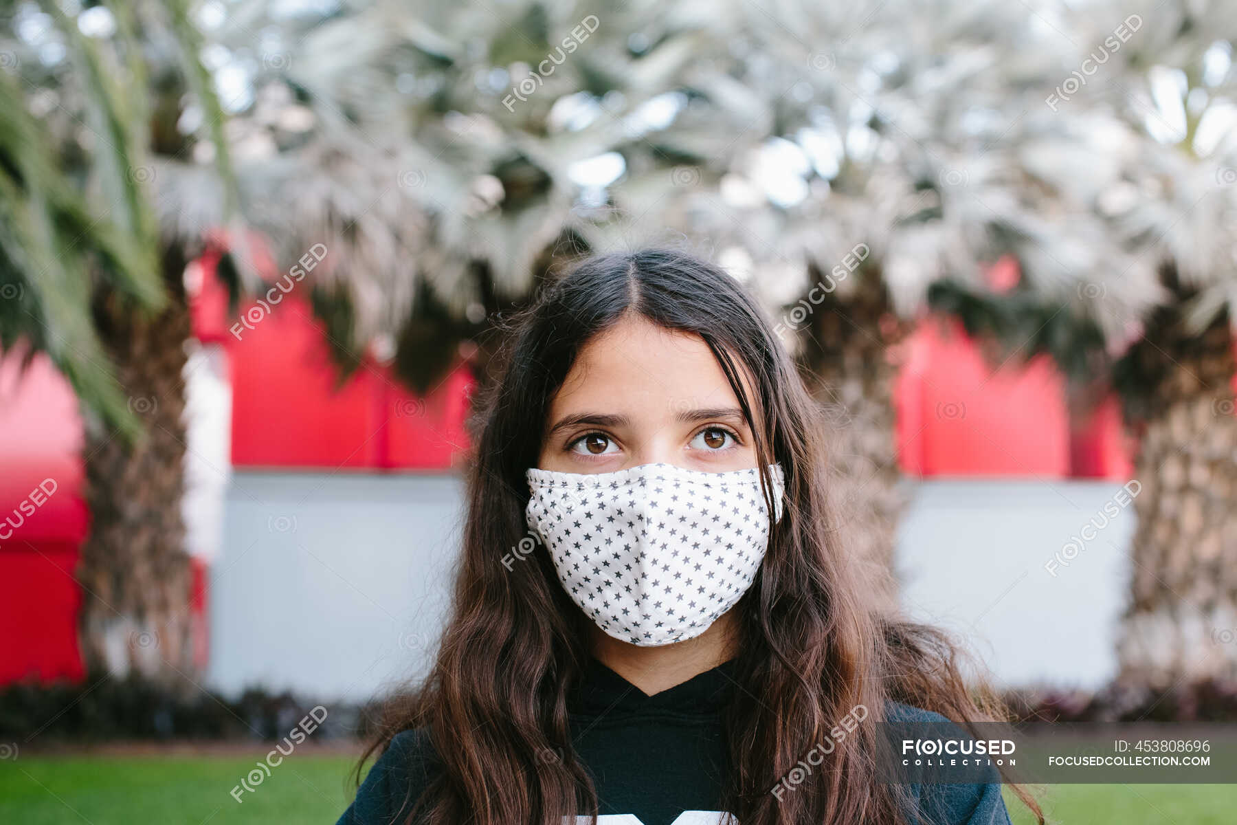 Tween Girl Wearing A Cloth Face Mask Outside Looking Yonder — people ...