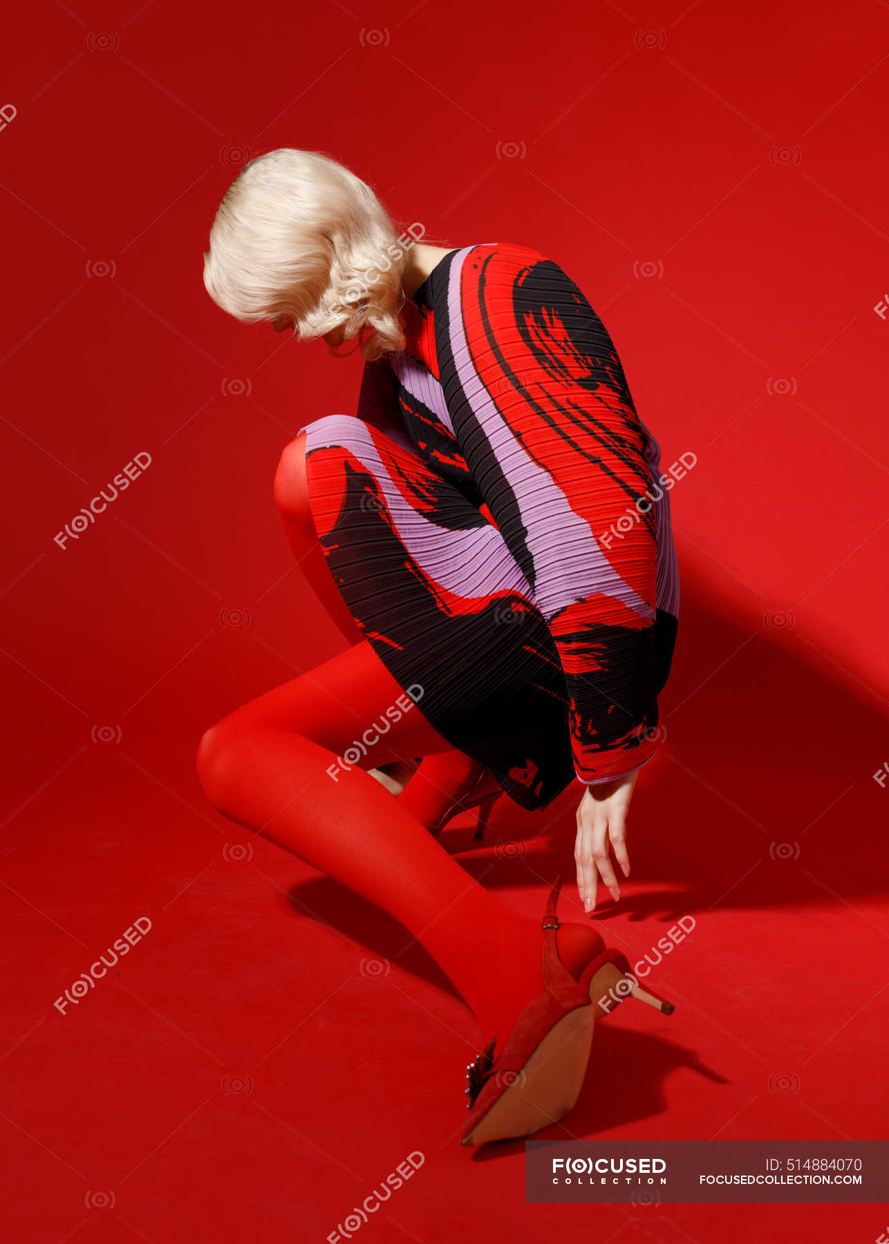 Female Fashion Model In Red Dress Posing Isolated On Red Background Sensual One Stock Photo Female Fashion Model In Red Dress Posing Isolated On Red Background Sensual One Stock Photo