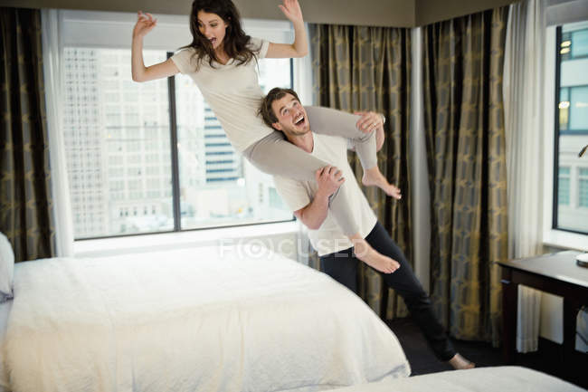 Young Cute Couple Having Fun In Hotel Room Two People