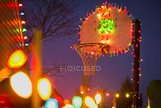 View Of Basketball Hoop Covered In Christmas Lights Christmas