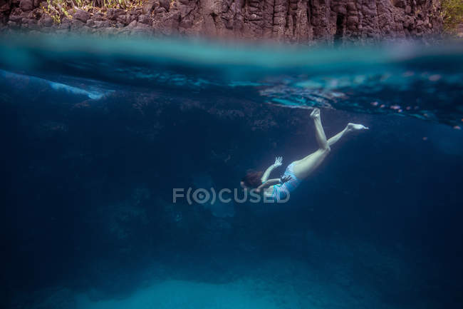 Young woman diving underwater. — Stock Photo