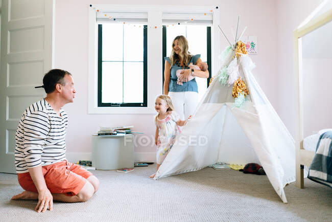 Happy family spending time together at home — Stock Photo