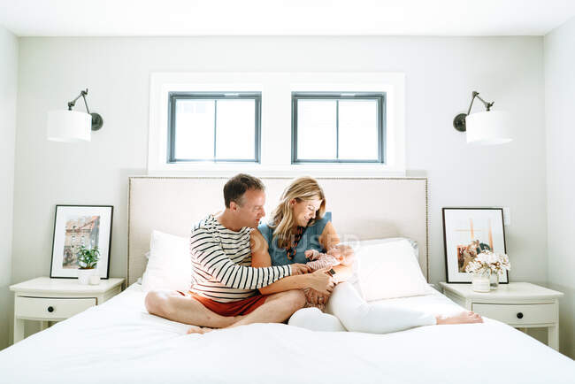 Happy parents with their baby together at home — Stock Photo