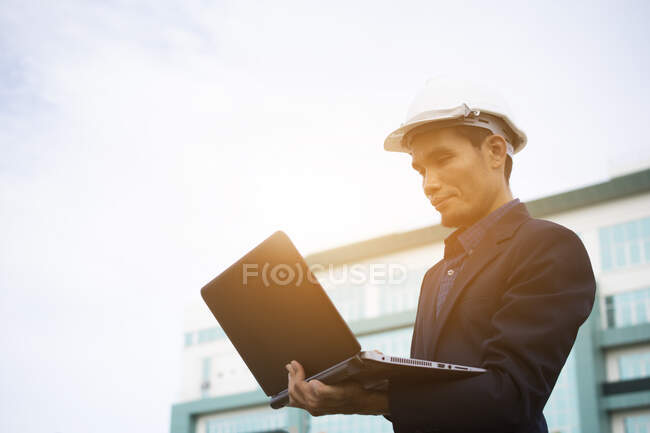 Businessman holding computer notebook work — Stock Photo