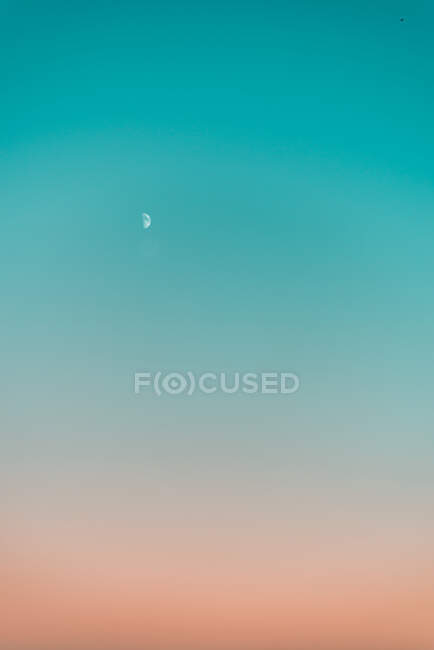 Gradient sky at sunset with Moon — стокове фото
