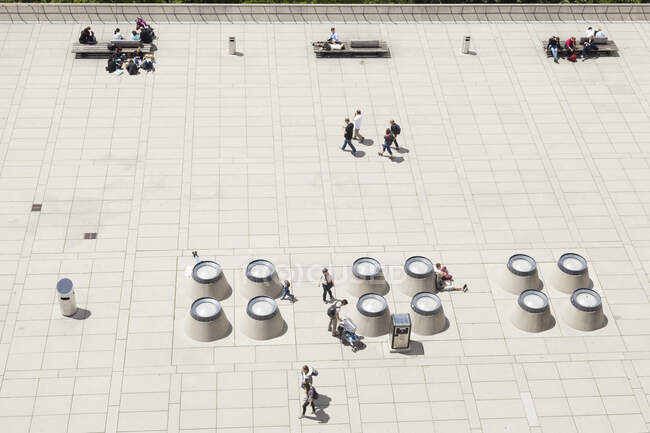 People walk across and relax on the Polyterrasse below the Federal Institute of Technology  in Zrich, Switzerland. - foto de stock
