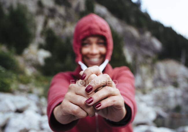 Unfocused portrait of a woman stretches her sweatshirt cord. — Stock Photo