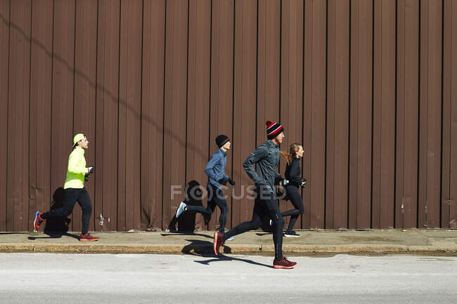 A group of athletes on a training run. — Stock Photo