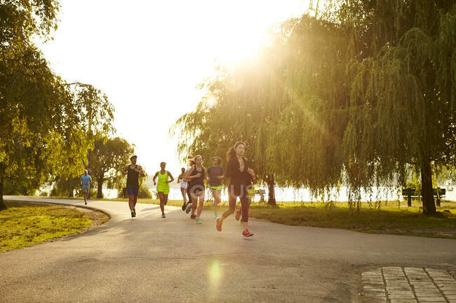 A group of runners on a run along the Charles River in Boston, MA. — Stock Photo