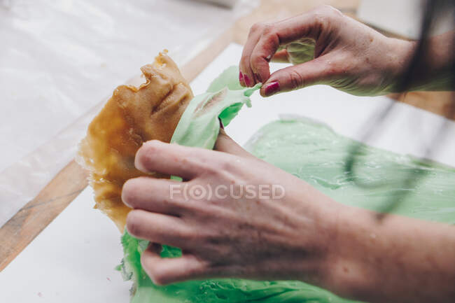 Wax and silicone casting revealing lips in artist studio — Stock Photo