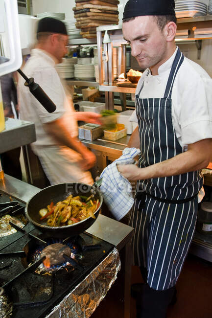 Chefs working at commercial kitchen in the UK — Stock Photo