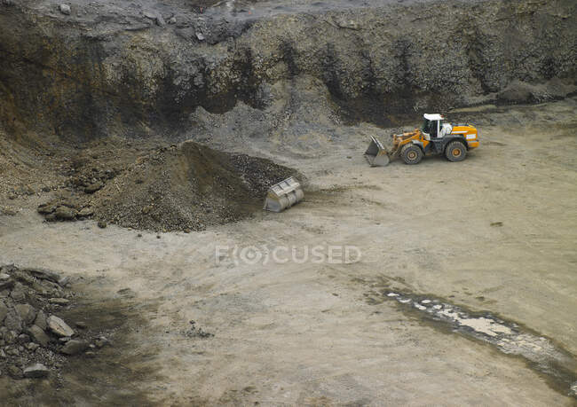Excavator on the road on nature background — Foto stock