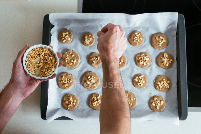 Chef preparing cookies for baking in the kitchen — Stock Photo