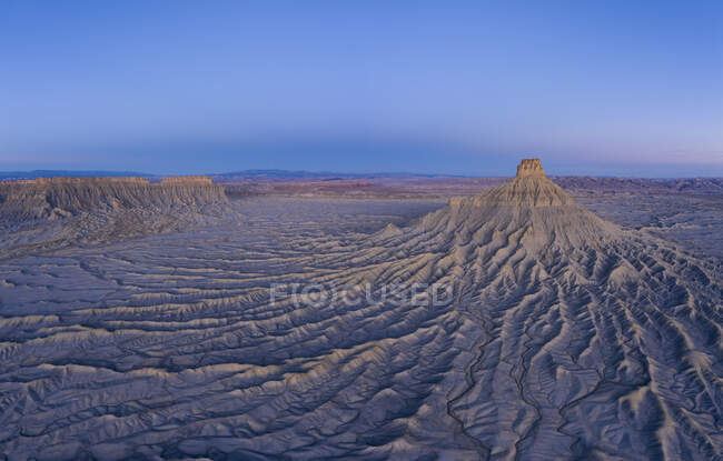 Erosion paints an abstract picture in the hills surrounding factory butte — Stock Photo
