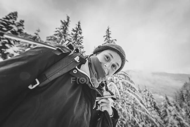 Low angle view Portrait of young woman in Manning Park Black and white — Stock Photo