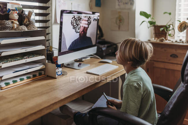 Midrange view of teacher and student learning over computer clas — Stock Photo