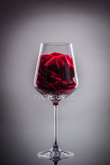 Close-up view of velvet in a glass on grey background — Stock Photo