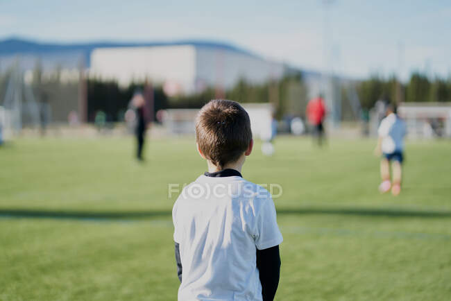 Gatekeeper children soccer player in action. stadium — Stock Photo