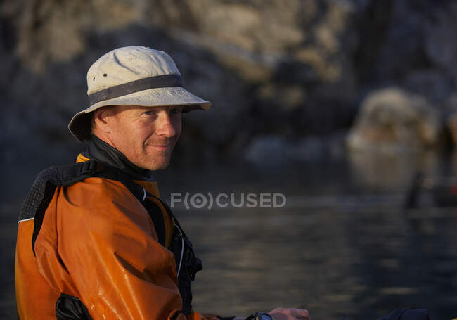 Portrait of man on a sea kayak in eastern Greenland — Stock Photo