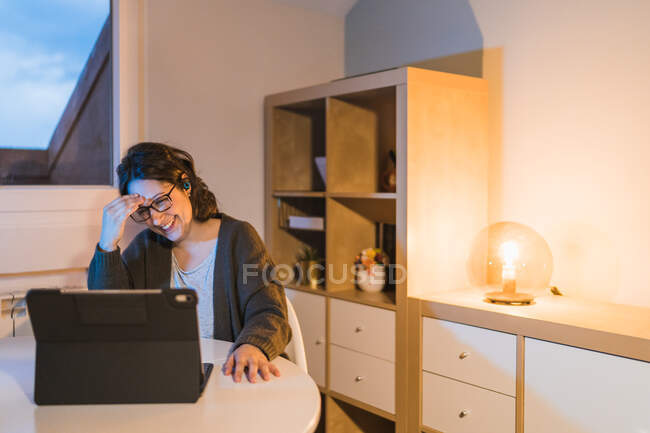 Woman working at home. working with a computer. Woman smiling — Stock Photo