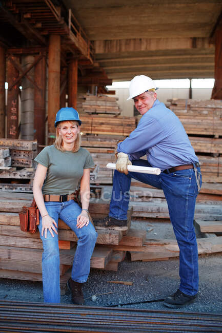 Portrait of male and female construction workers — Stock Photo