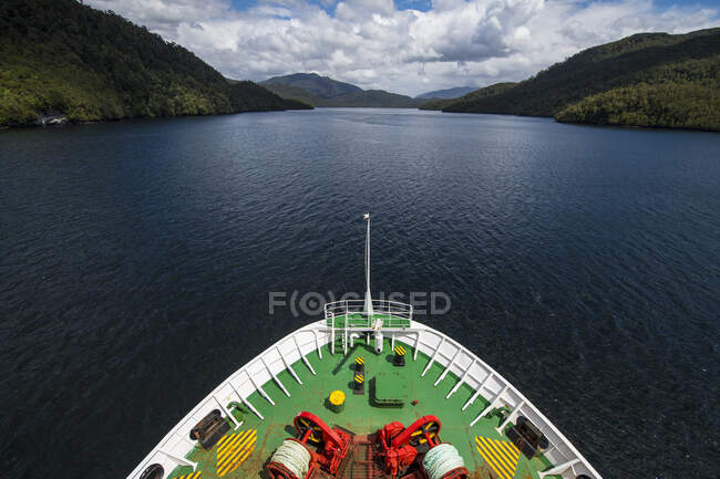 Passenger vessel navigating through narrow fjord in Patagonia — Stock Photo