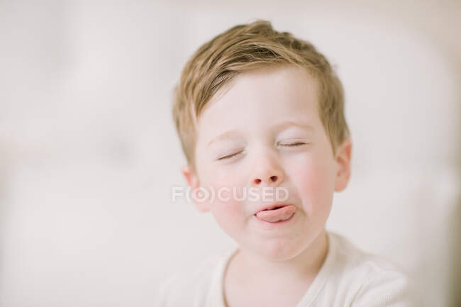 Silly Preschooler sticking out tongue up close — Stock Photo