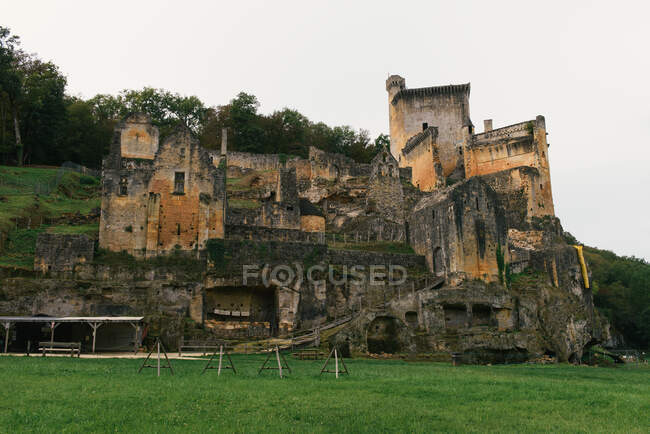 The crumbling facade of the medieval Castle Commarque — Stock Photo
