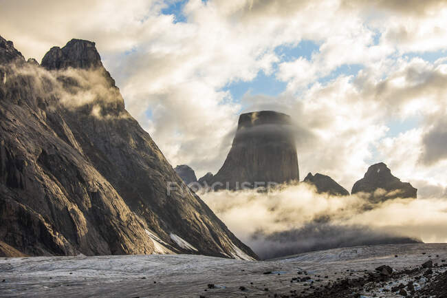 Mt. Loki and Mt. Asgard emerge from the clouds as a storm blowing over — Stock Photo