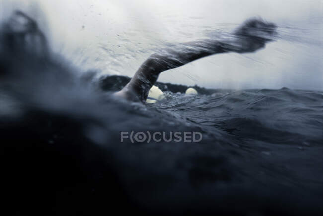 Endurance of an open water swimmer in a race — Stock Photo
