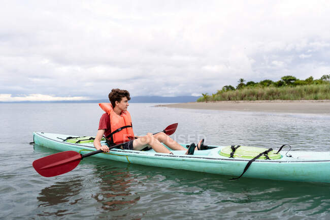 Teen relaxing in kayak in Costa Rica — Stock Photo