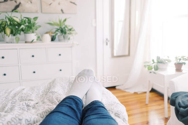 A persons perspective of a bedroom in beautiful light. — Stock Photo