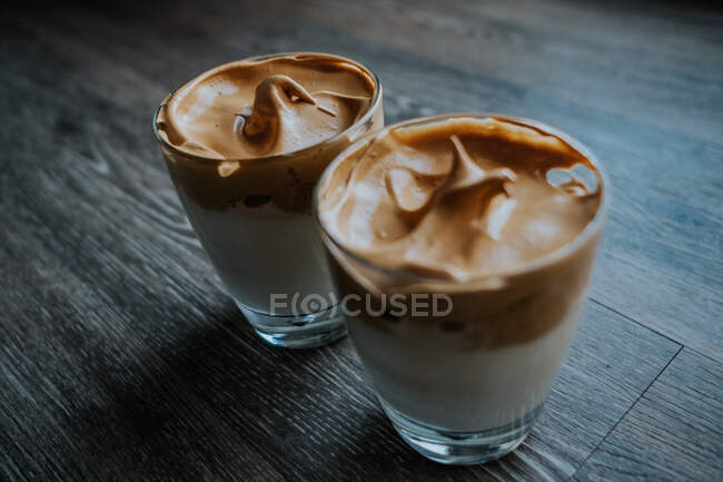 Side view of whipped coffee in glass cups on table — Stock Photo