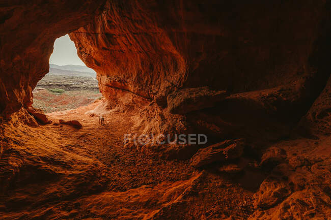 Desert cave entrance overlooking the suburbs of St. George Utah — Stock Photo