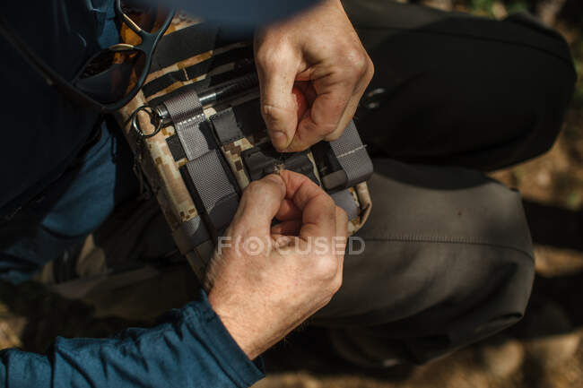 Fisherman ties on a fly — Stock Photo