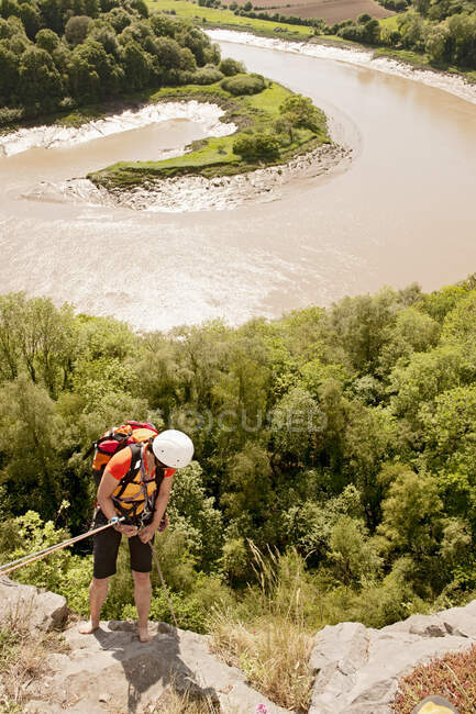 Woman rappelling of cliff in south Wales — Stock Photo