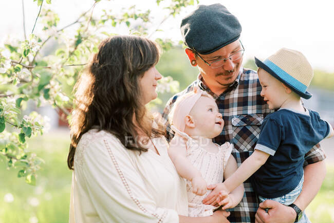 A sweet family moment with two children looking at each other — Stock Photo