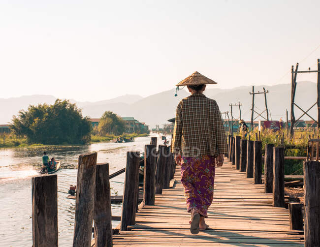 Rear view of local woman walking in Myanmar — Stock Photo