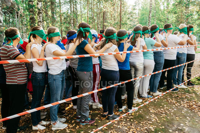Team in a team building in the forest — Stock Photo