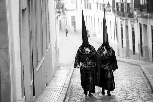 Spanish holy week in seville with nazarenes and religious celebration — Stock Photo