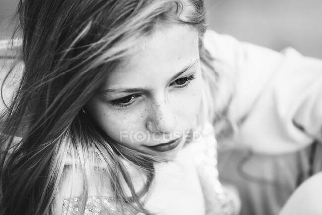Black and white portrait of a beautiful young girl with freckles. — Stock Photo