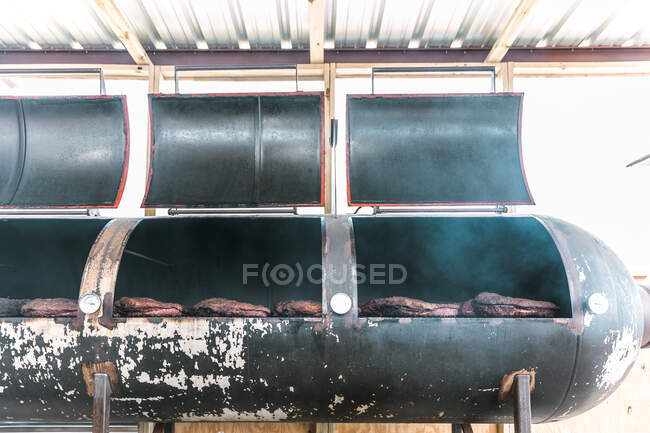 Briskets Cooking in a Smoker — Stock Photo